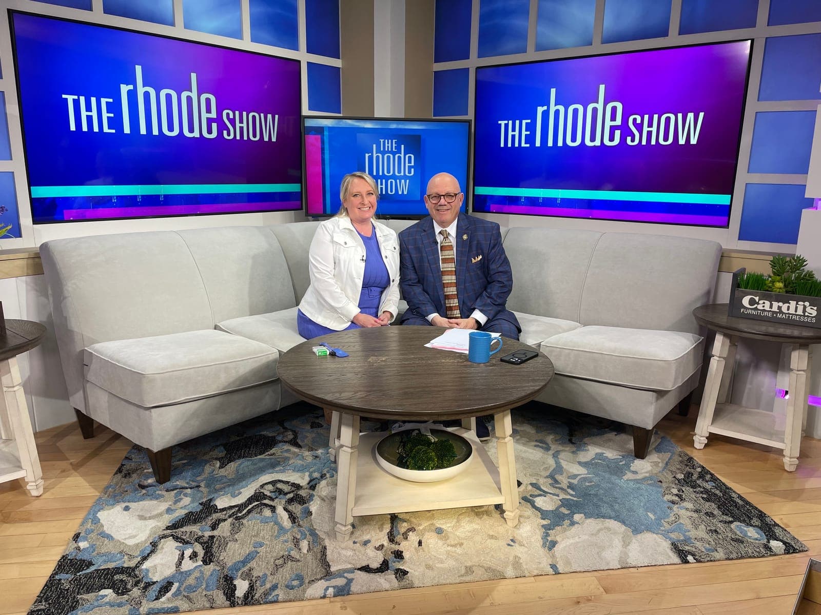 Two guests on the set of The Rhode Show.