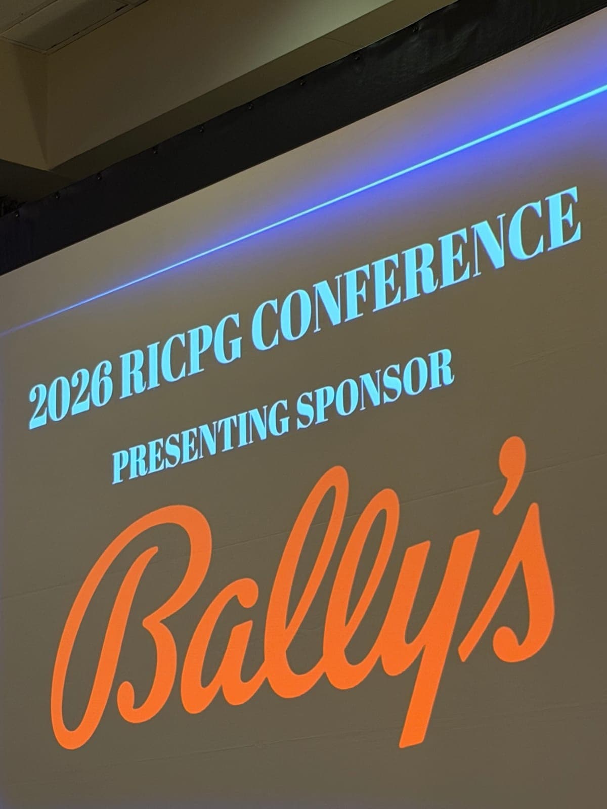 A screen reading "2026 RICPG Conference, presenting sponsor Bally's".