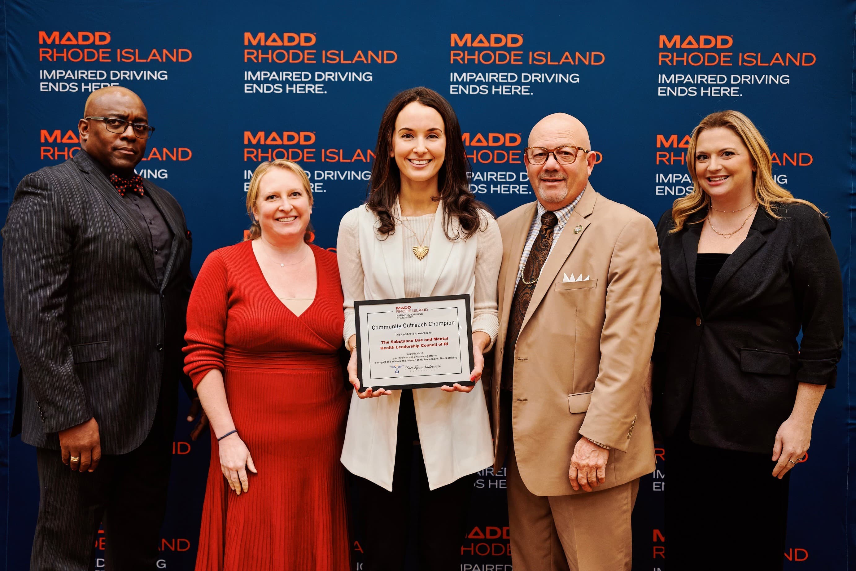 SUMHLC staff holding award