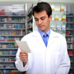 pharmacist reading a prescription